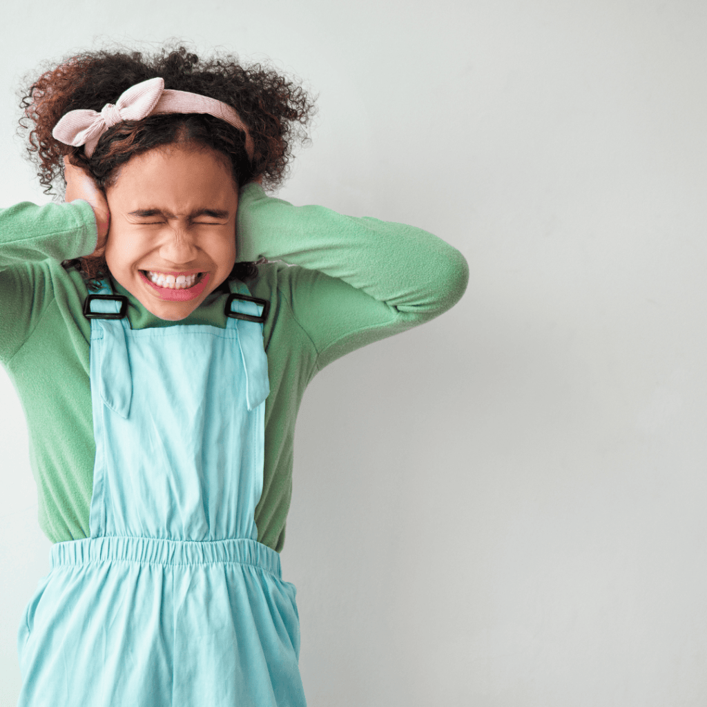 upset girl covering ears