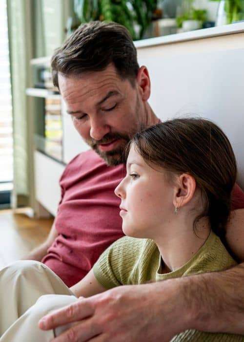 Father consoling child